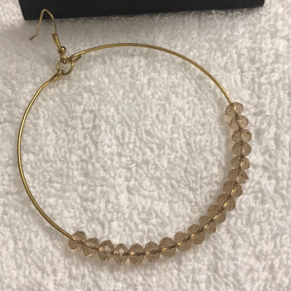 Hoop earrings with tan color beads